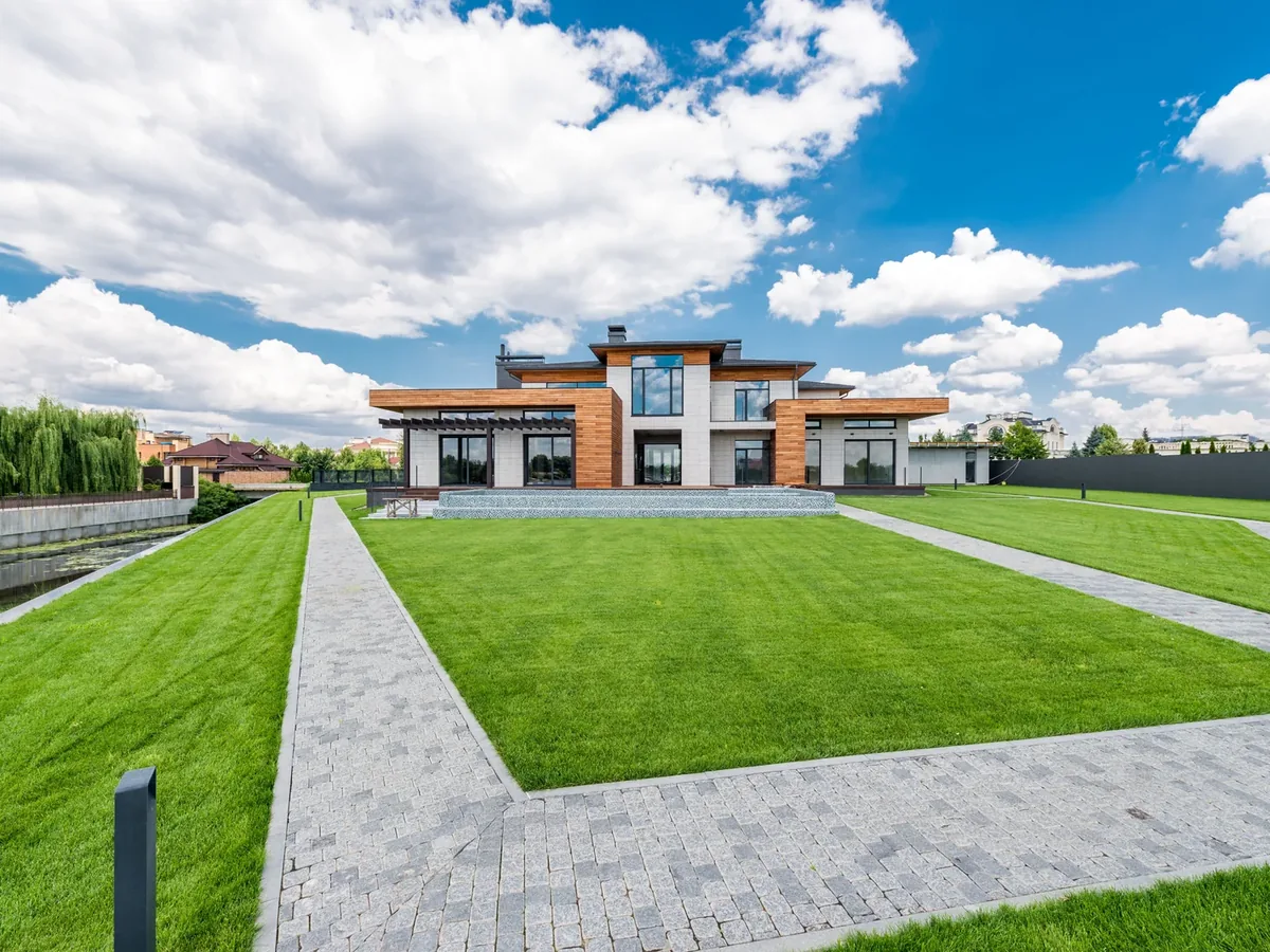 Wide lawn with clean paver walkways